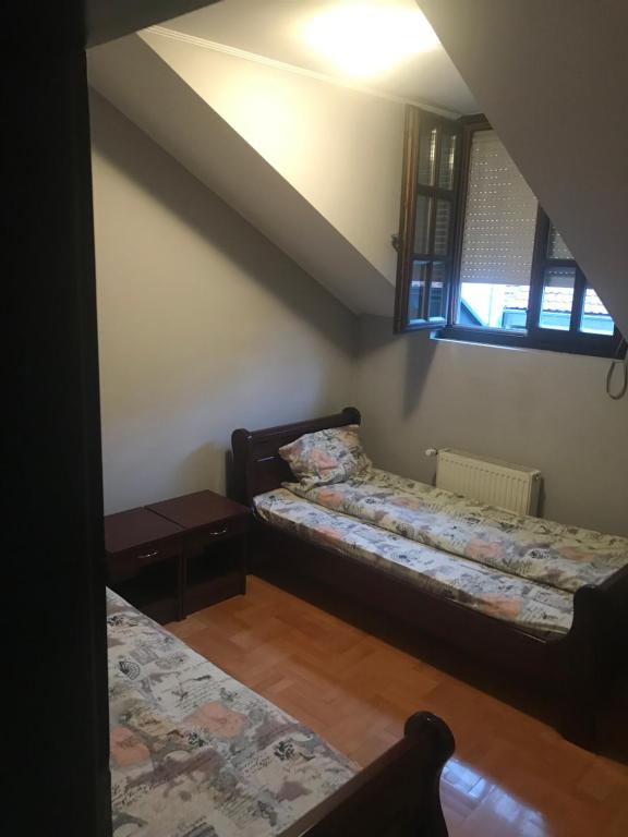 Postel nebo postele na pokoji v ubytování Kaplarević Smeštaj Ivanjica