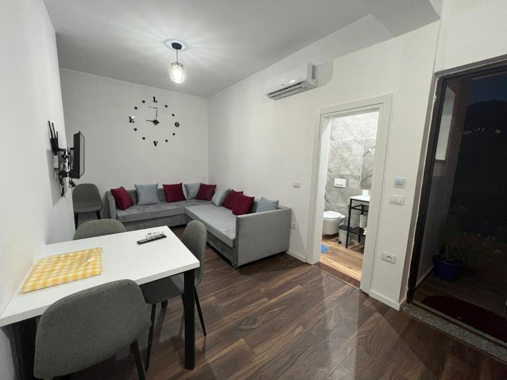 a living room with a couch and a table at Victoria Houses, Vlore Albania in Vlorë