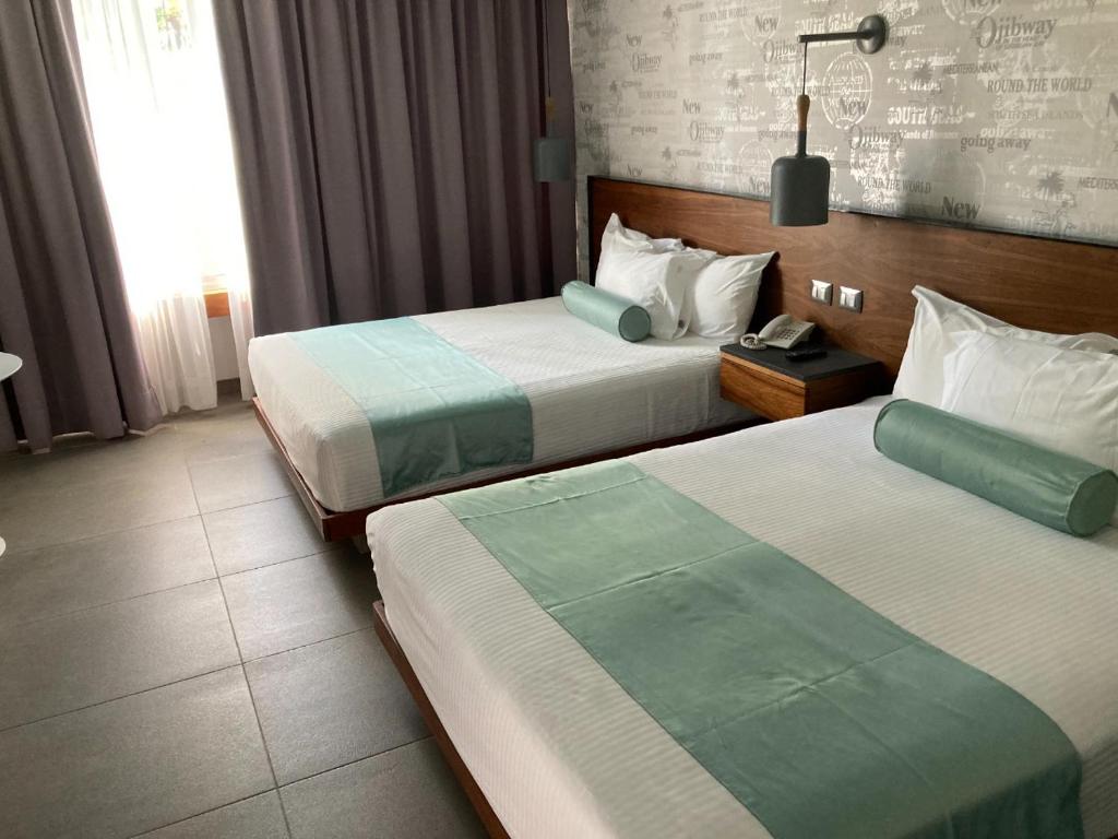 Postel nebo postele na pokoji v ubytování Hotel Y Parque Acuático La Caldera