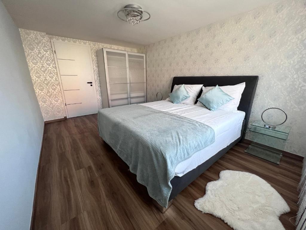 Tempat tidur dalam kamar di Elizabeth´s apartments