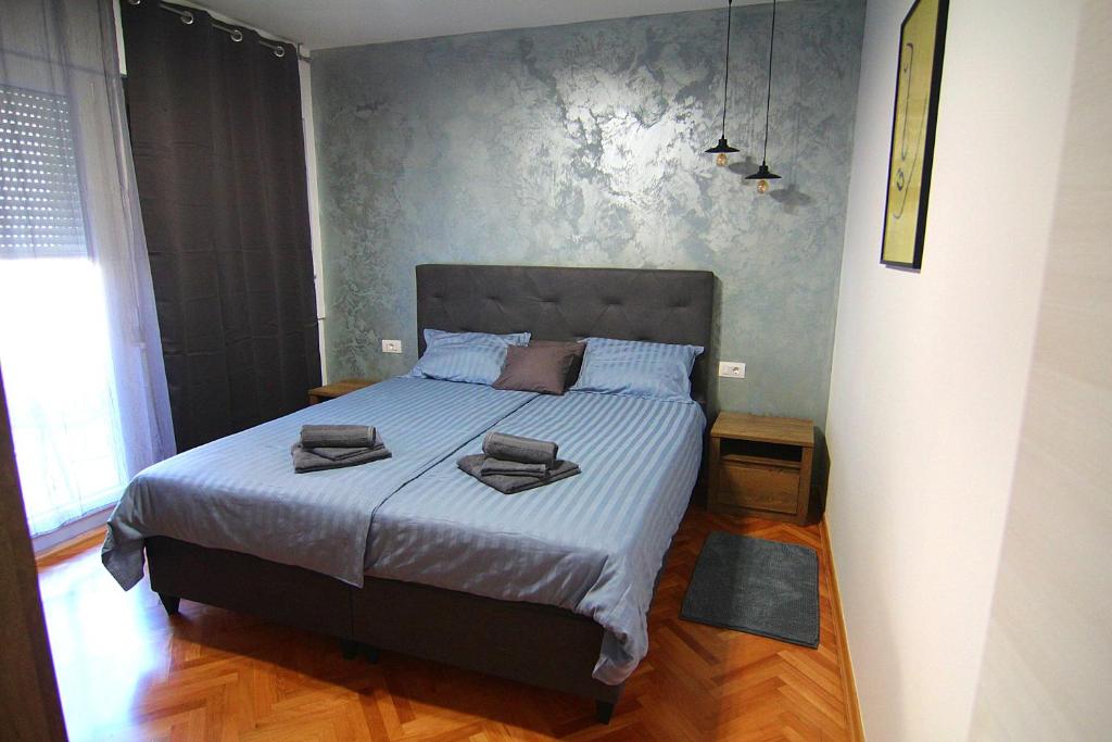 En eller flere senge i et værelse på Apartman Stella Veruda