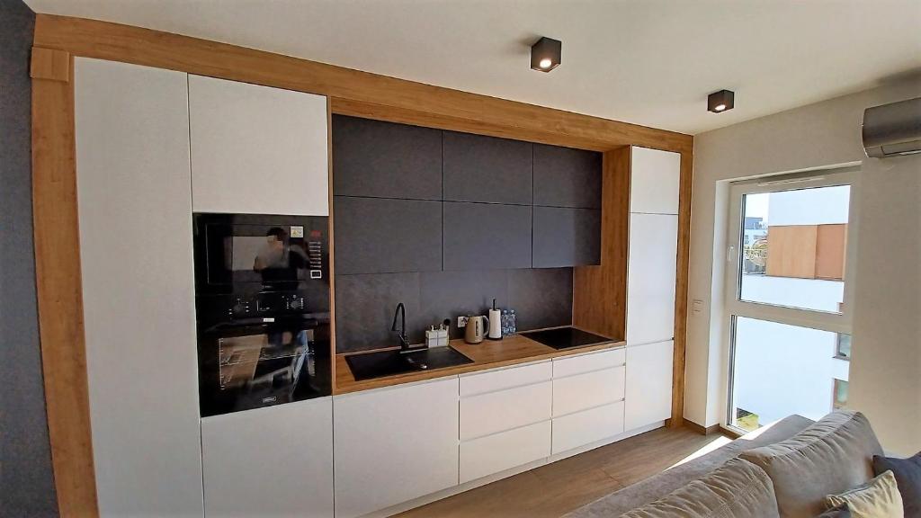 Kuchyňa alebo kuchynka v ubytovaní Kima Apartament Bażantów 44