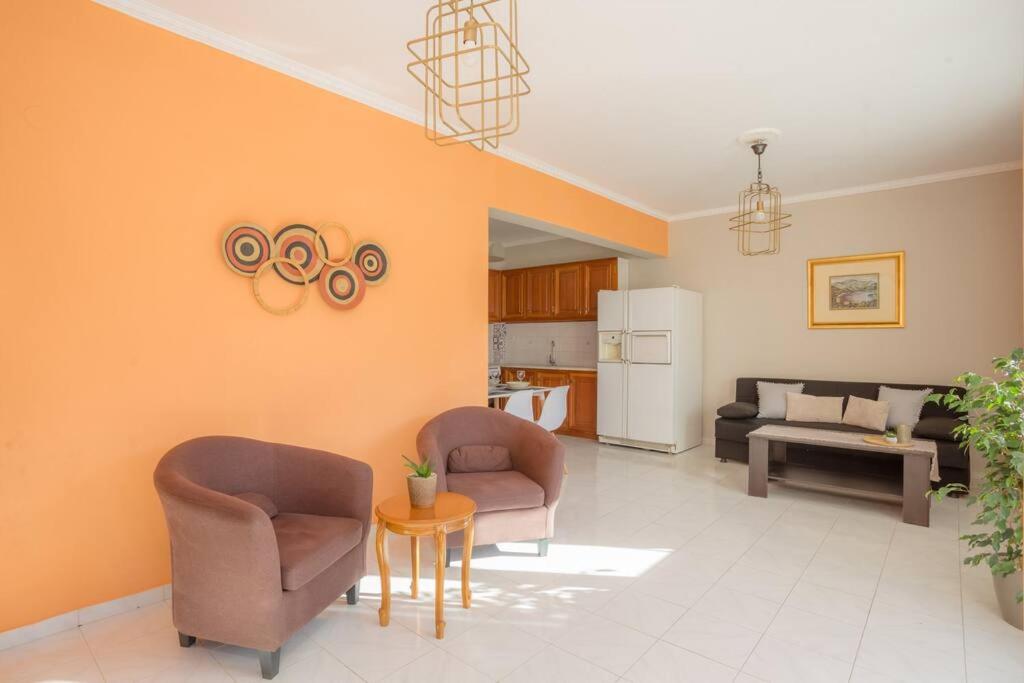 A seating area at New  2 bedroom/ 2 bath ap.Nidri, Familia