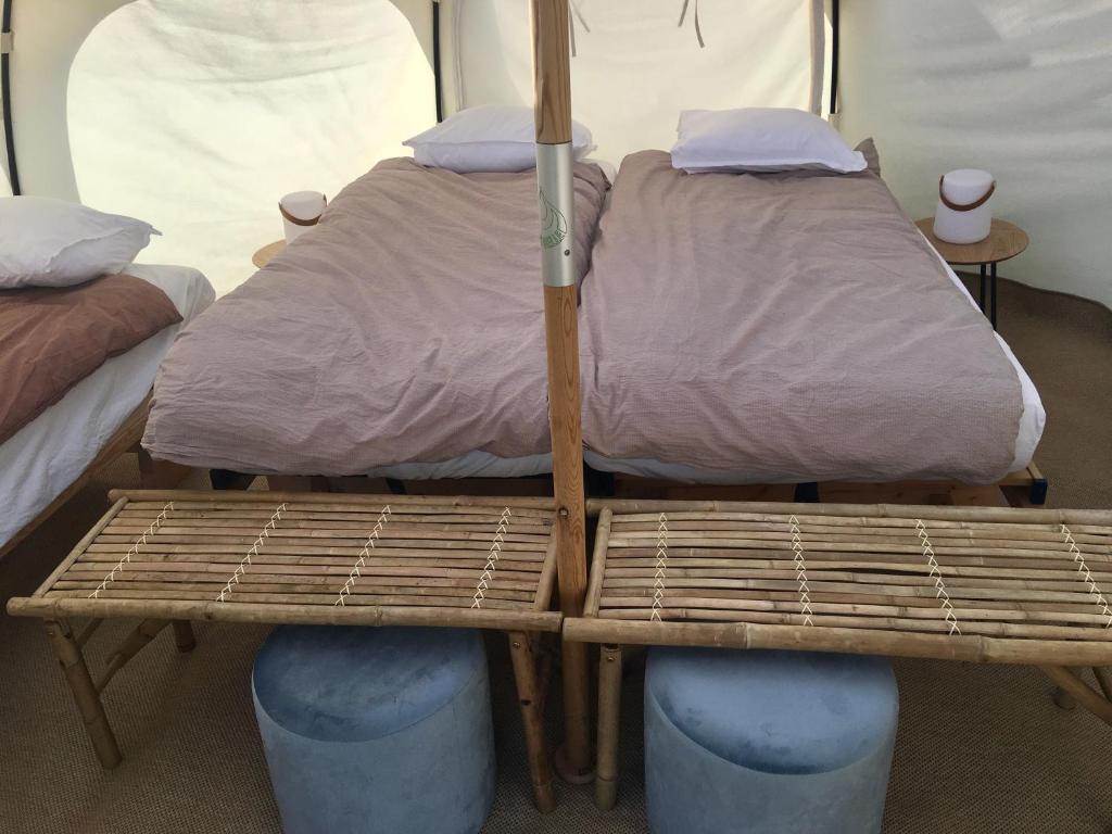 a couple of beds in a room at Hvidegaard Møn in Stege
