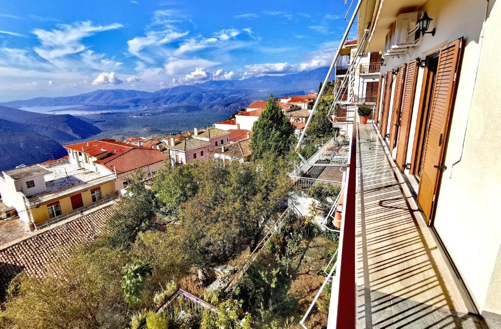 a view of a city from a balcony of a building at Delphic Horizons in Delphi