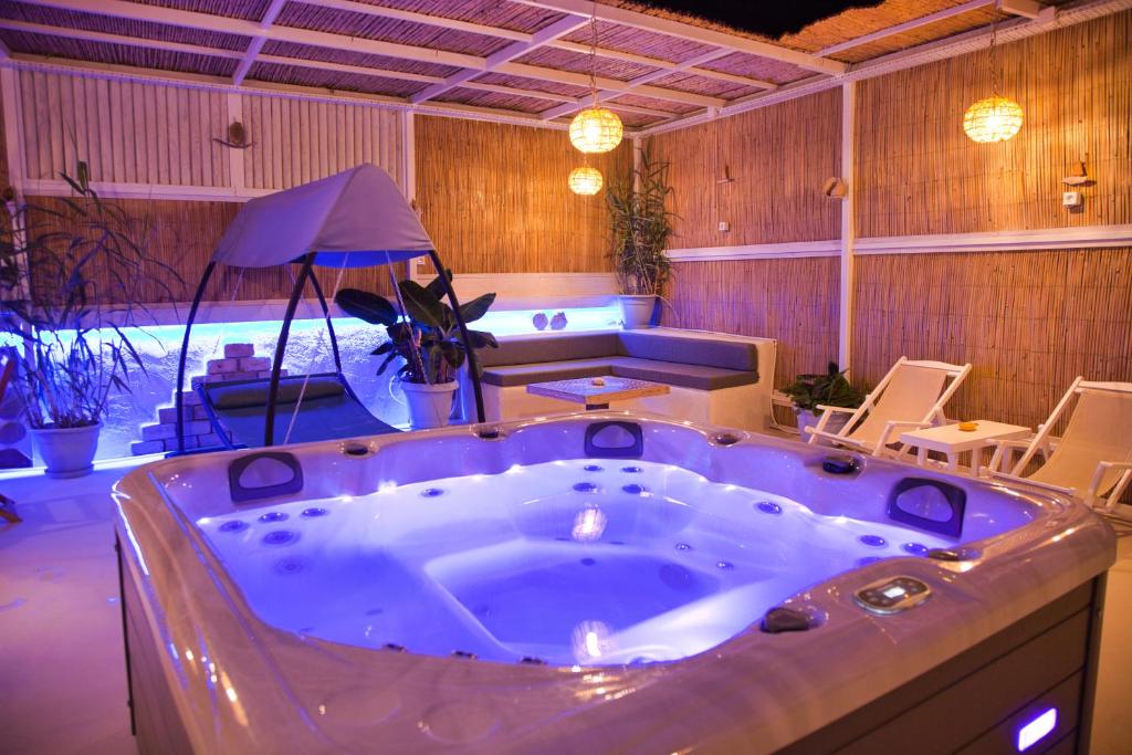 a large jacuzzi tub in a room at Porfyra Suite & Spa 1 in Skala