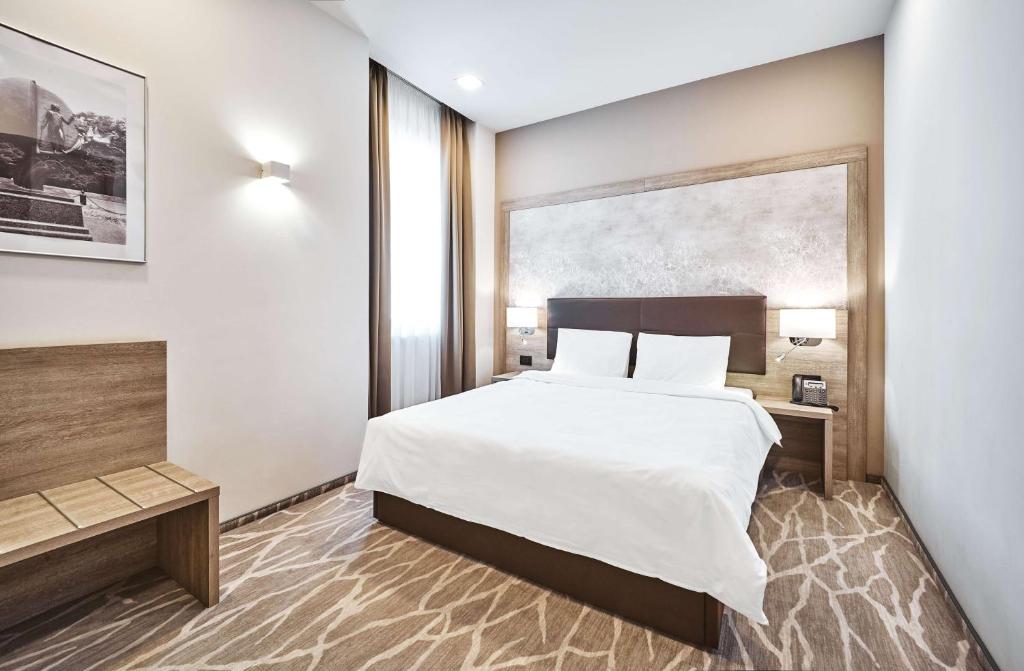 Postel nebo postele na pokoji v ubytování Radisson Hotel City Centre Odesa