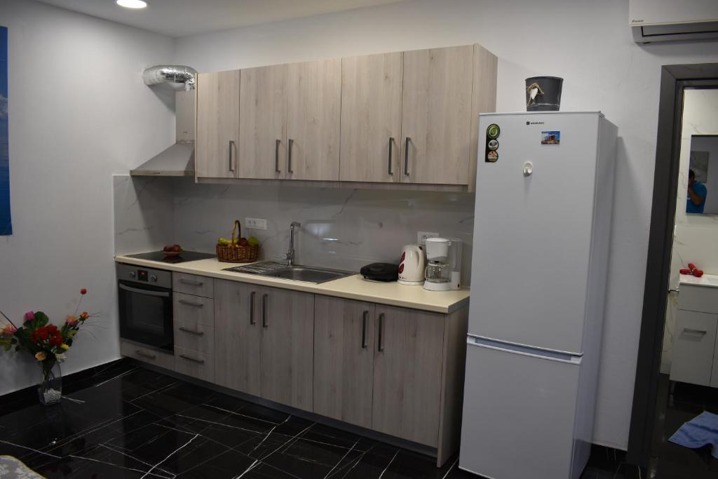 Kuchyň nebo kuchyňský kout v ubytování Istron Corner Apartments