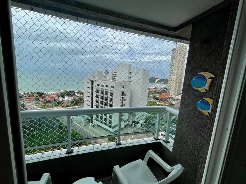 a bathroom with a view of a city from a balcony at Marina Bezerril - Pontamares 903 - O melhor de Natal in Natal