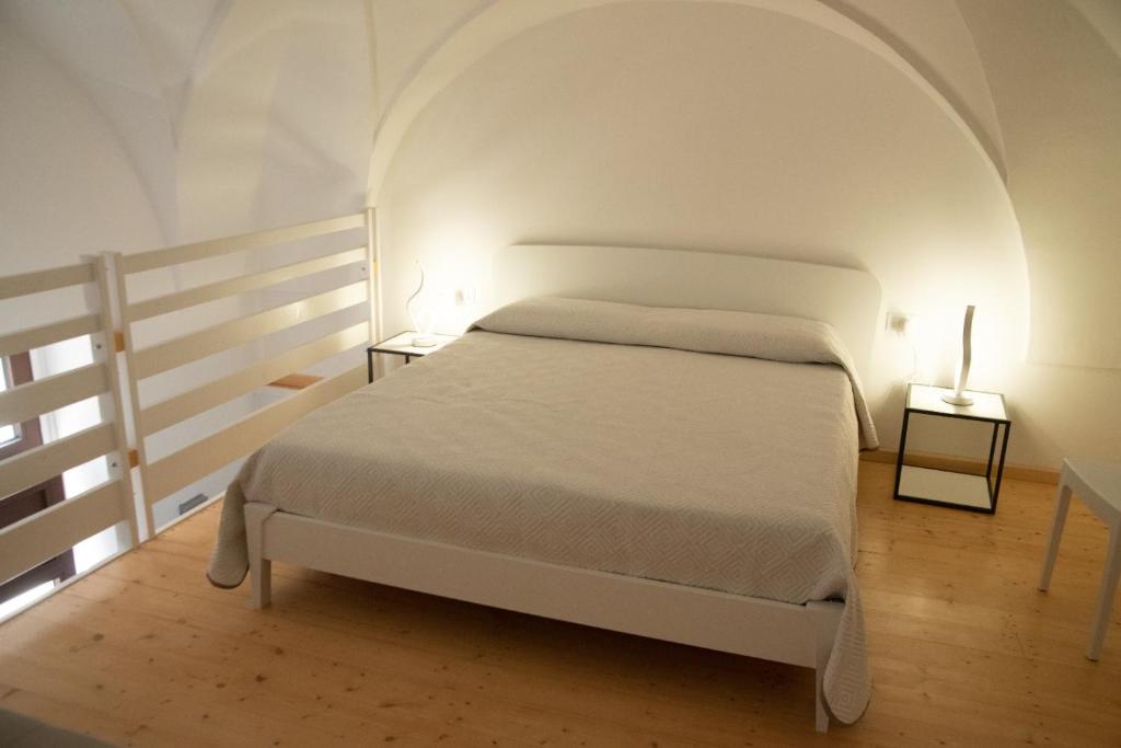 Łóżko lub łóżka w pokoju w obiekcie Al muro casa vacanza