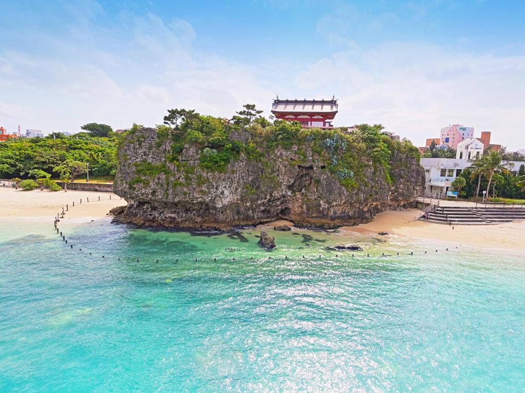 an island in the ocean with a building on it at Hotel Abest Naha Kokusaidori in Naha