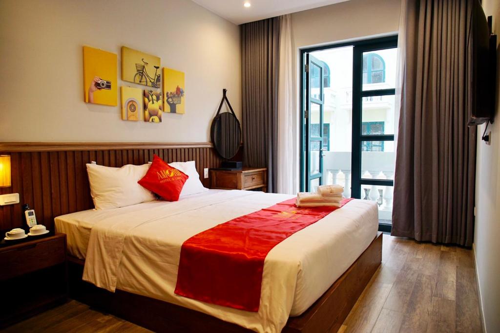 Giường trong phòng chung tại Amorii Hotel