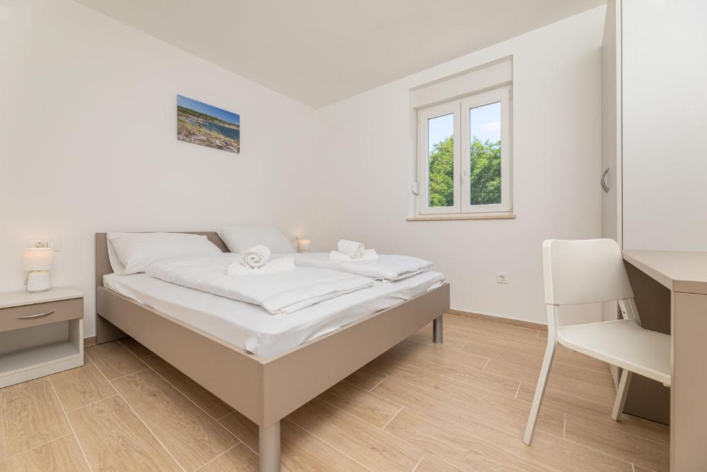 Кровать или кровати в номере Apartments Sucic 2