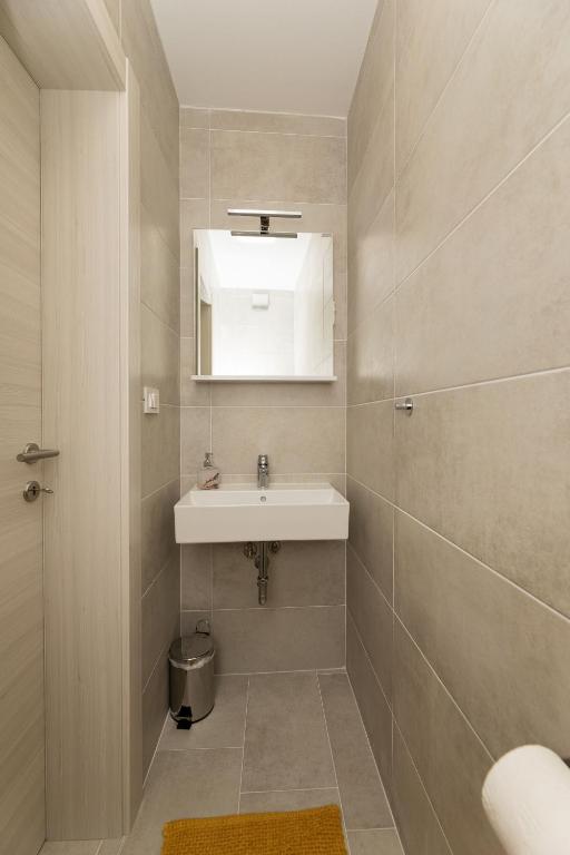 Ванная комната в Apartments Sucic 2