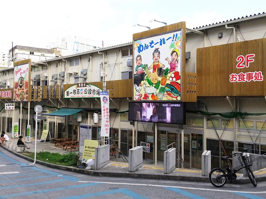 a building with signs on the side of a street at Hotel Abest Naha Kokusaidori in Naha