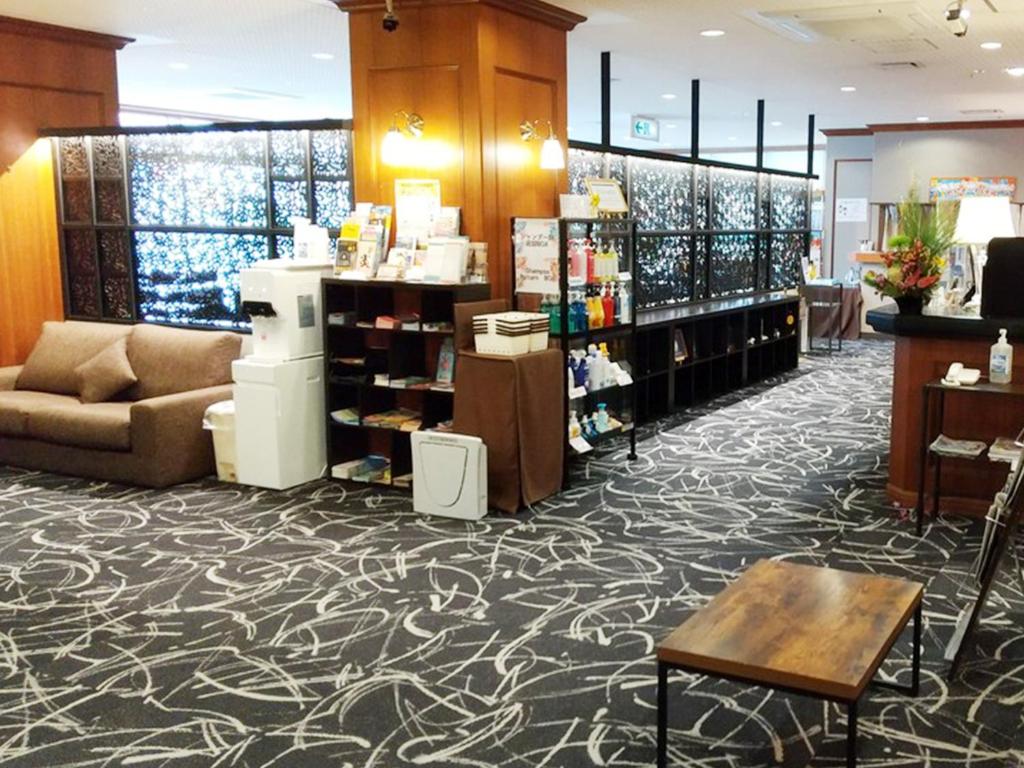 a store lobby with a couch and a table at Hotel Abest Naha Kokusaidori in Naha