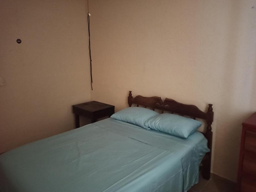 Una cama o camas en una habitación de Casita Mahahual, Grand Costa Maya