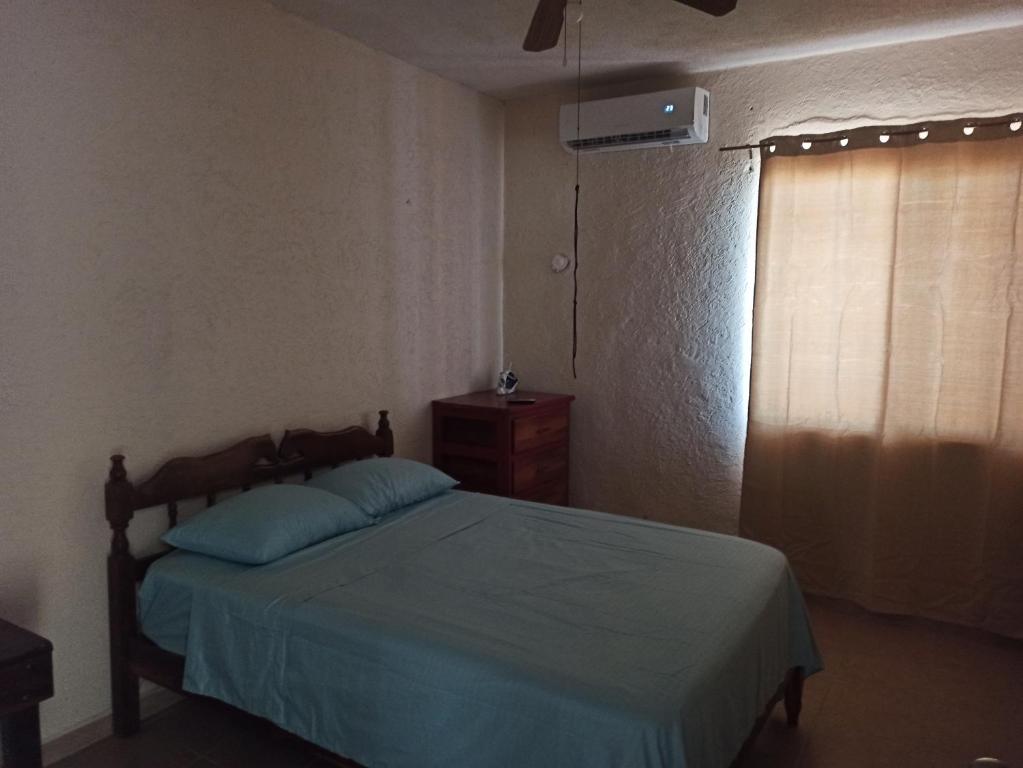 Una cama o camas en una habitación de Casita Mahahual, Grand Costa Maya