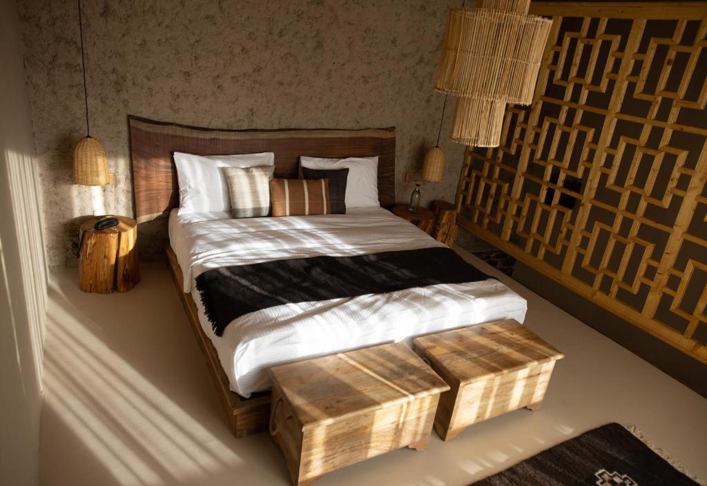 Postel nebo postele na pokoji v ubytování Dolkhar Resort