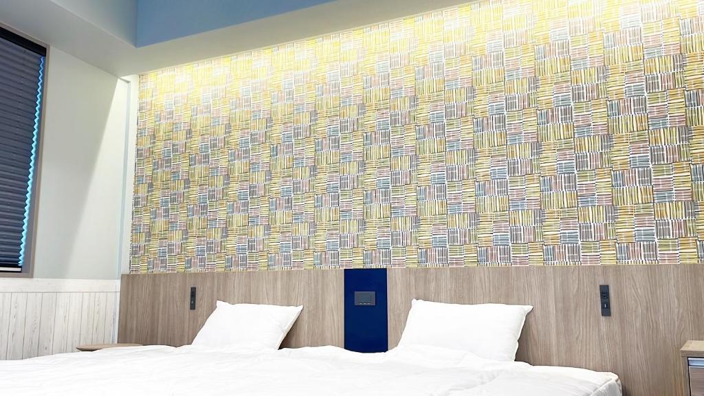 Postel nebo postele na pokoji v ubytování KOKO HOTEL Residence Asakusa Tawaramachi