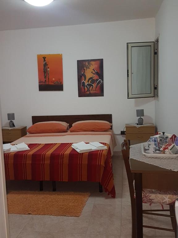 Postel nebo postele na pokoji v ubytování casa al mare kalispera