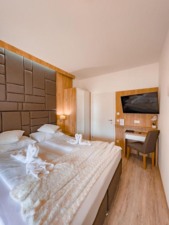 Postel nebo postele na pokoji v ubytování Sylpaulerhof Aparthotel
