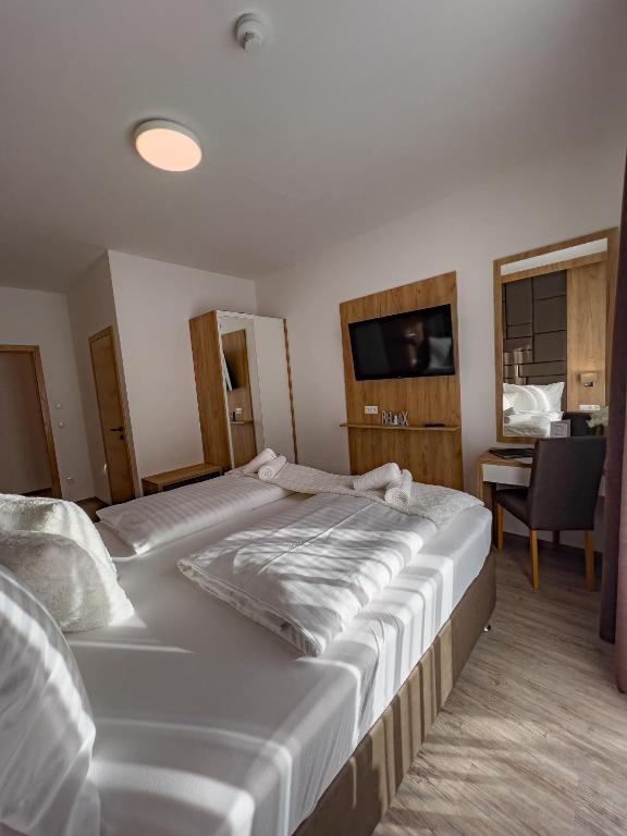 Postel nebo postele na pokoji v ubytování Sylpaulerhof Aparthotel