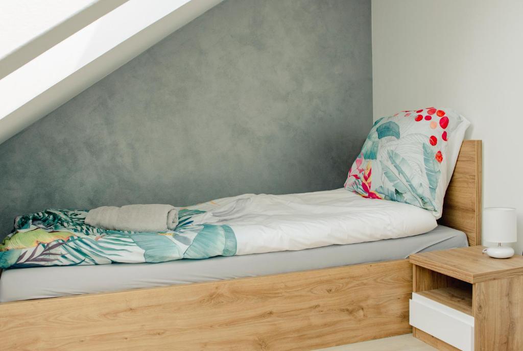 Posteľ alebo postele v izbe v ubytovaní Apartamenty Jordanów - Stacja Paliw MOYA