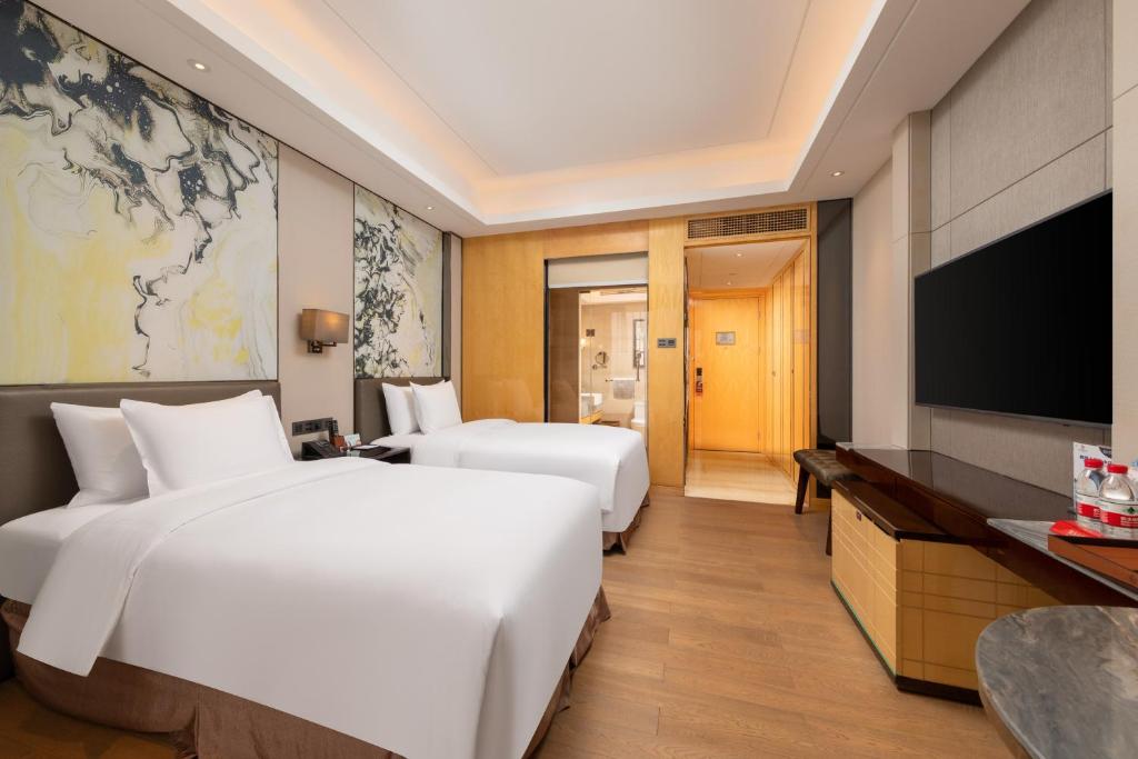 TV a/nebo společenská místnost v ubytování Zhuhai Longzhuda International Hotel