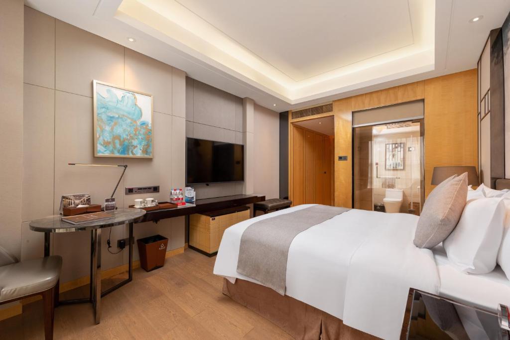 TV a/nebo společenská místnost v ubytování Zhuhai Longzhuda International Hotel