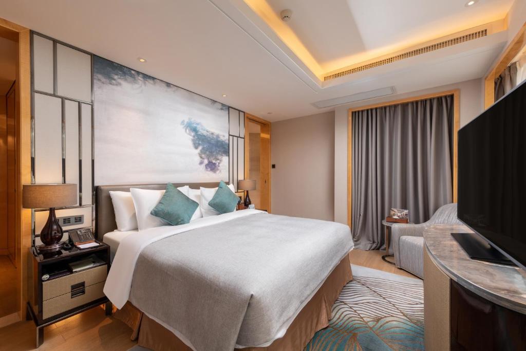 TV a/nebo společenská místnost v ubytování Zhuhai Longzhuda International Hotel
