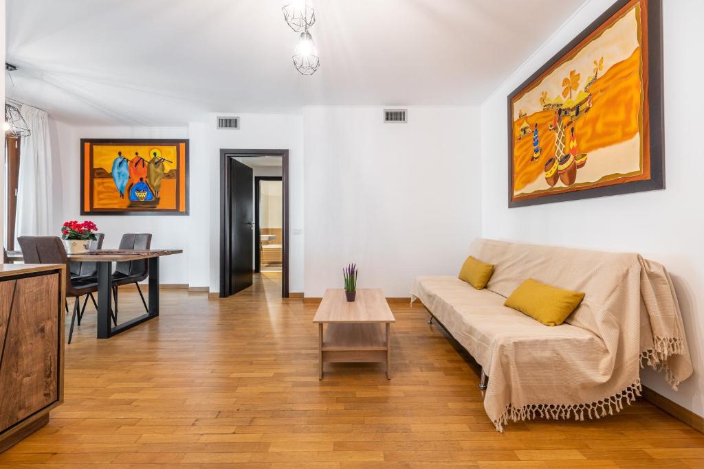 a living room with a couch and a table at Casa Paola in Cagliari