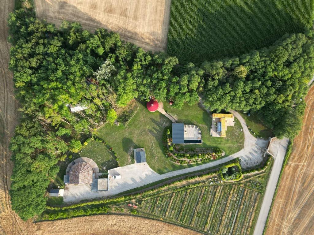 an aerial view of a farm in a field at DES BRANCHES & VOUS in Châteauneuf-sur-Isère