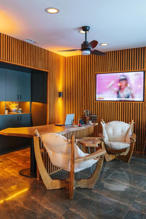 a dining room with a table and two chairs at Akkan Hotel in Bodrum City