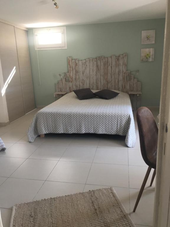 Posteľ alebo postele v izbe v ubytovaní Appartement dans la colline