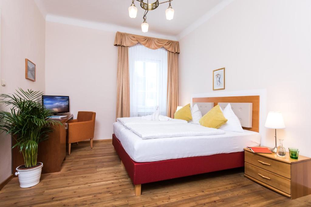 Postel nebo postele na pokoji v ubytování Hotel am See - Seeresidenz