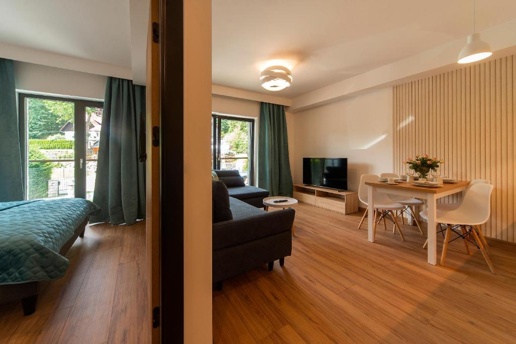 Televízia a/alebo spoločenská miestnosť v ubytovaní Apart Invest Centrum Park 6