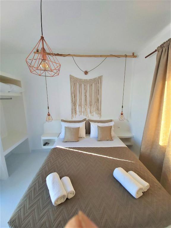 Postel nebo postele na pokoji v ubytování Sea Nymphs Suites