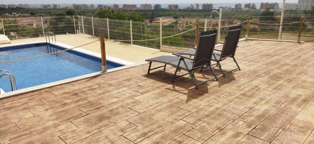 Bazén v ubytování CALA HOUSE II Luminoso adosado con vistas,piscina comunitaria y parking incluido nebo v jeho okolí