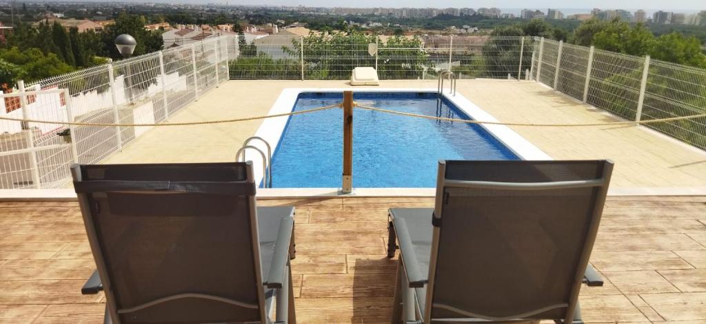 Bazén v ubytování CALA HOUSE II Luminoso adosado con vistas,piscina comunitaria y parking incluido nebo v jeho okolí