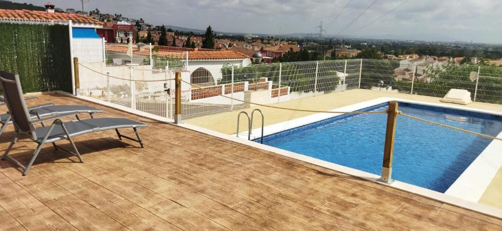 Bazén v ubytování CALA HOUSE II Luminoso adosado con vistas,piscina comunitaria y parking incluido nebo v jeho okolí