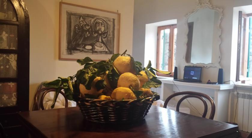 a basket of lemons sitting on a table at antica dimora in Barbarano Romano