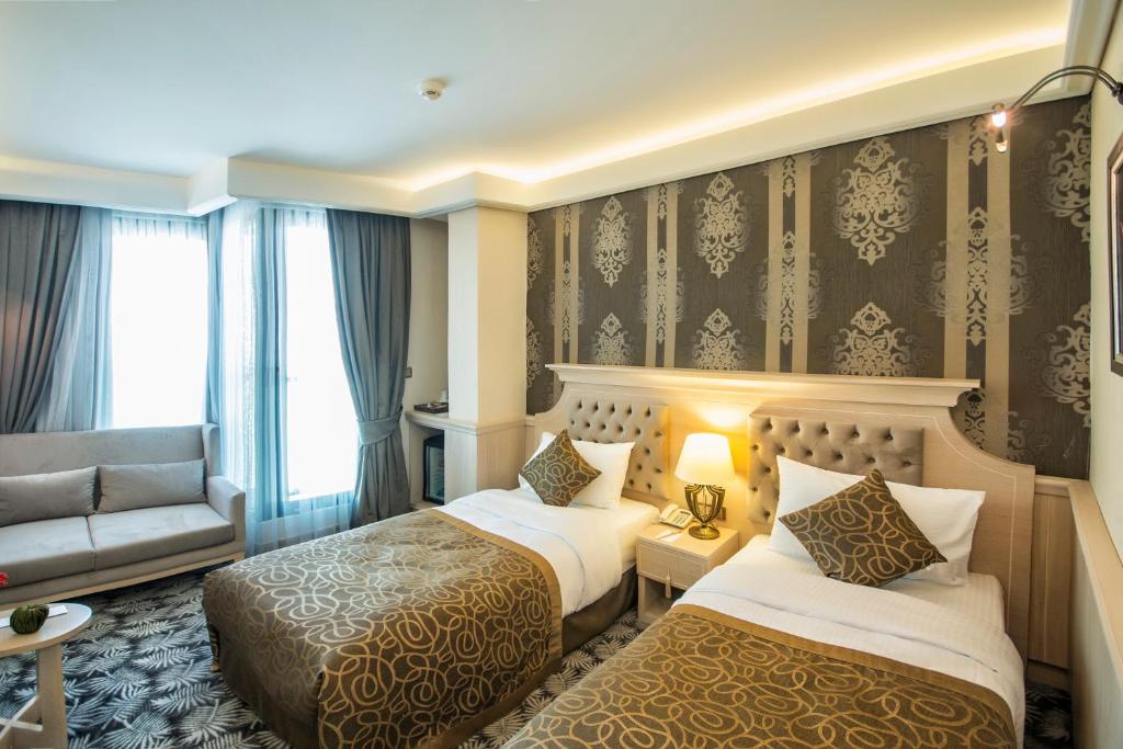 A bed or beds in a room at The Conforium Hotel İstanbul