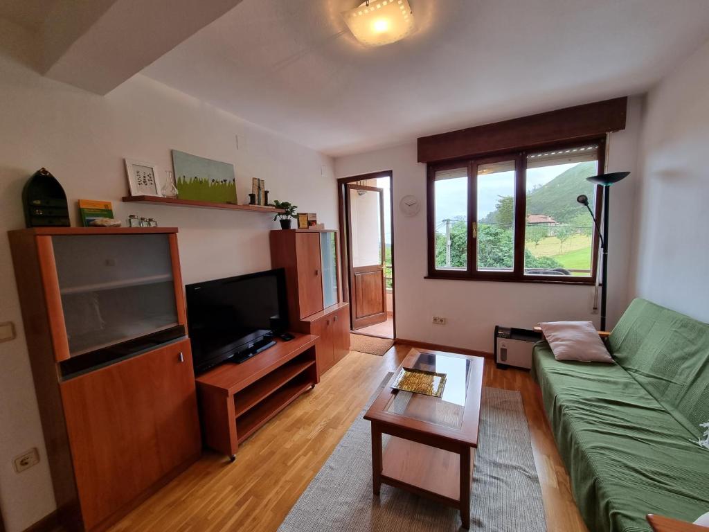 TV a/nebo společenská místnost v ubytování 17C01 Apartamento Caravia