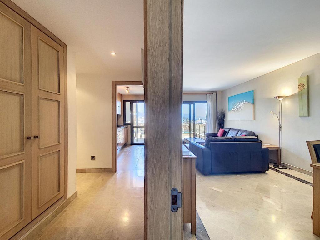 A seating area at Lovely apartment with pool & sea views - Marina Del Castillo 2129