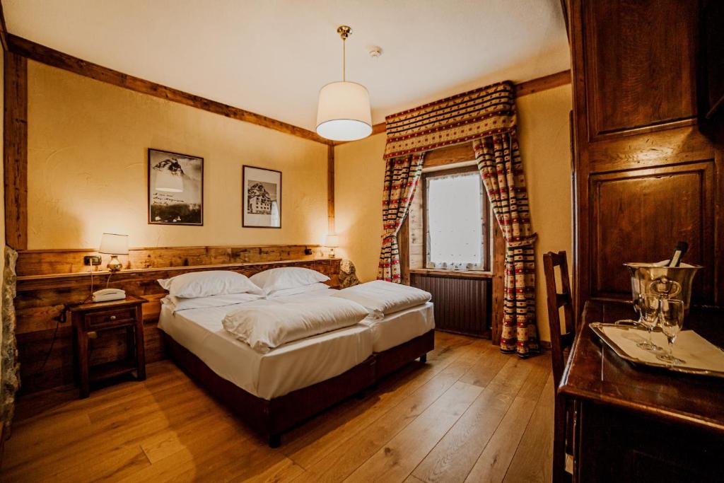 Postel nebo postele na pokoji v ubytování Hotel Jumeaux