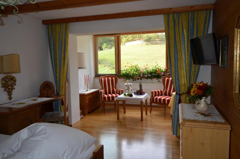 Postel nebo postele na pokoji v ubytování Sporthotel Zugspitze