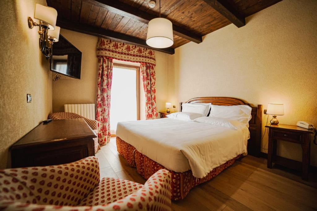 Postel nebo postele na pokoji v ubytování Hotel Jumeaux