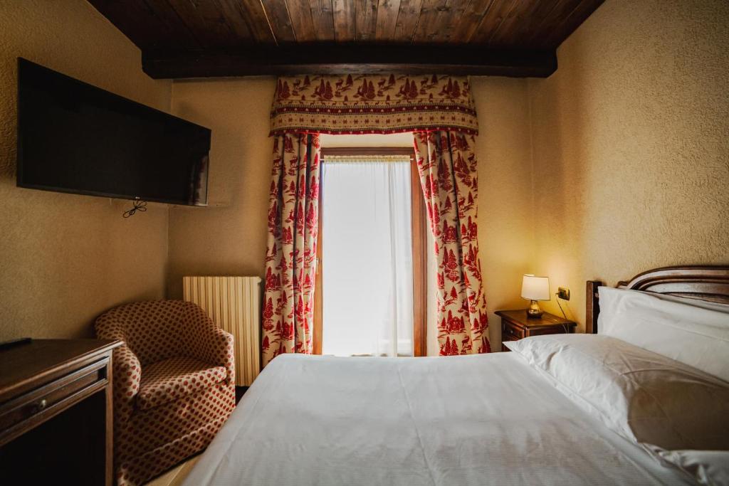 Postel nebo postele na pokoji v ubytování Hotel Jumeaux