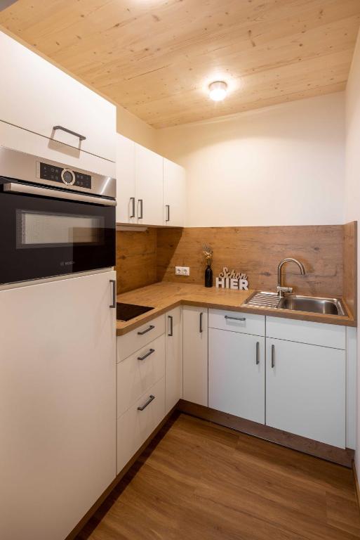 Kuchyň nebo kuchyňský kout v ubytování Hotel Sonnenhang